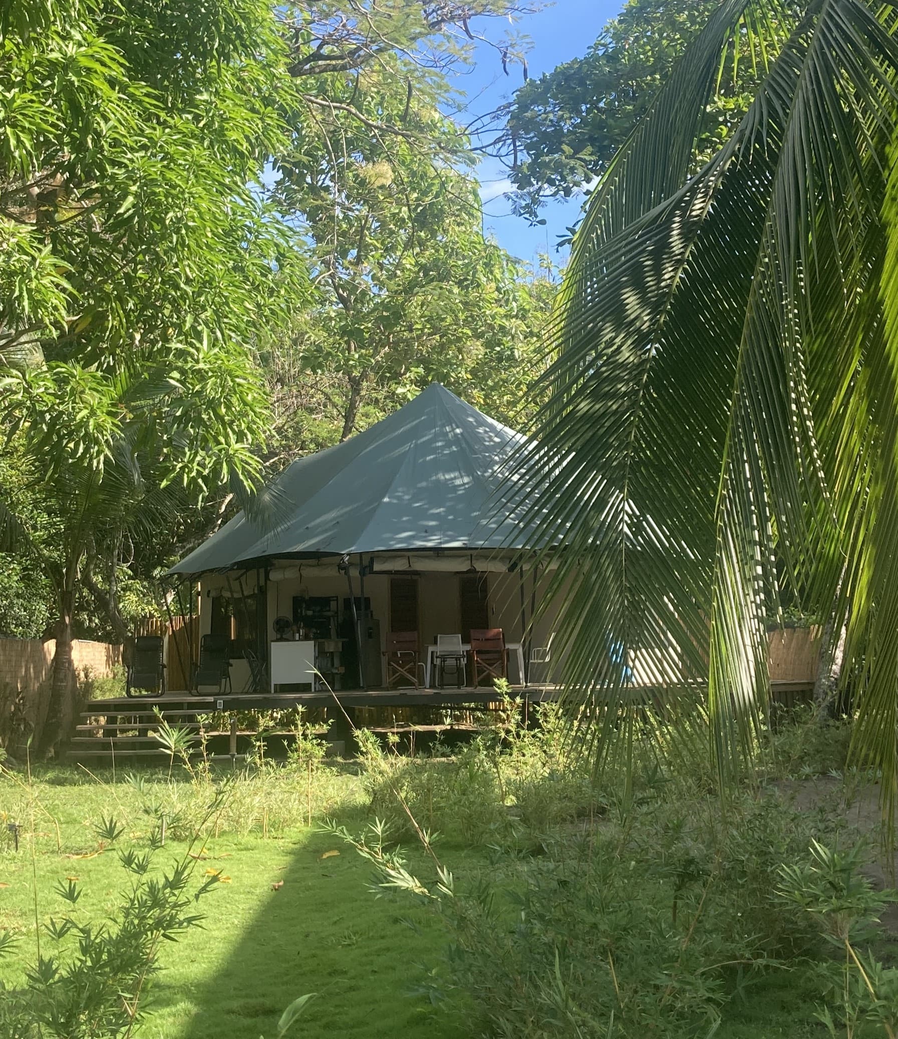 A BaliBala luxury safari tent under the green canopy
