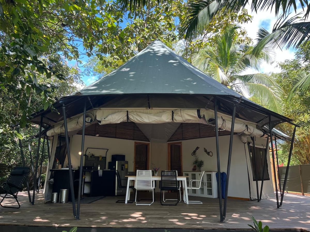 Safari Tent Hideaway, the tent and its deck under the palms